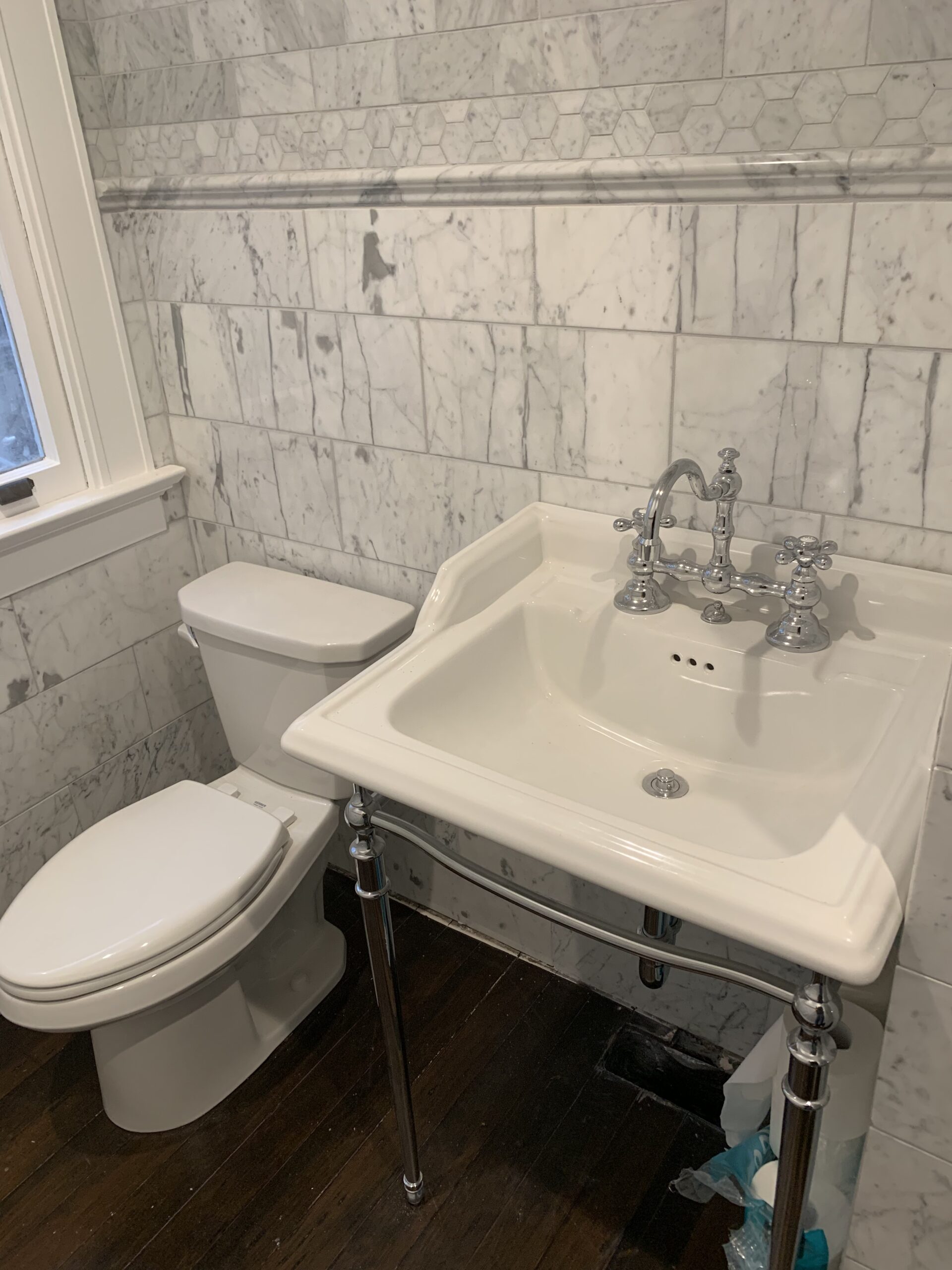 Copy of IMG_1319 bathroom featuring a toilet and a pedestal sink" title="bathroom featuring a toilet and a pedestal sink